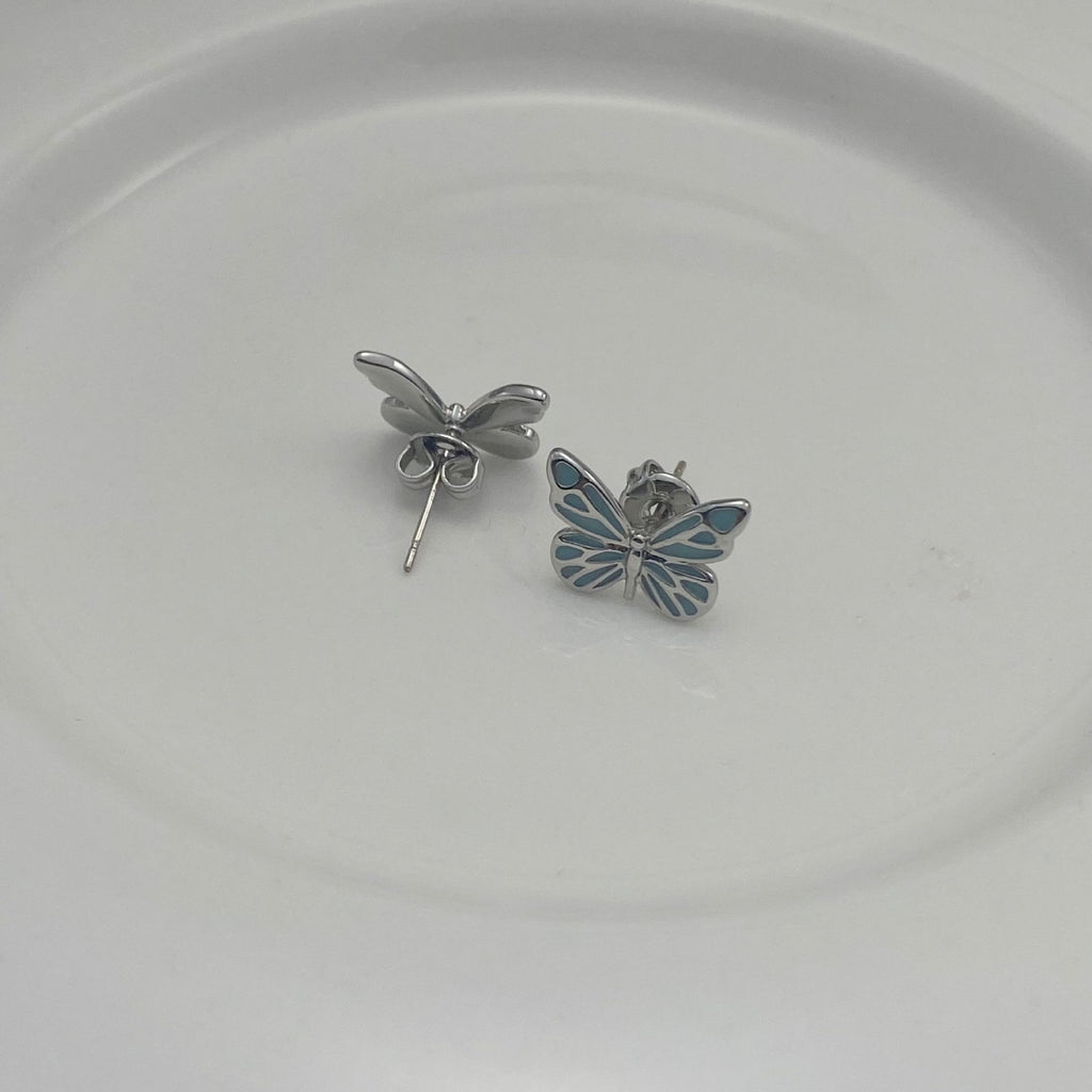 Boucles d'oreilles élégantes en argent avec pendentif papillon lumineux