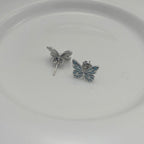 Boucles d'oreilles élégantes en argent avec pendentif papillon lumineux