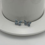 Boucles d'oreilles élégantes en argent avec pendentif papillon lumineux